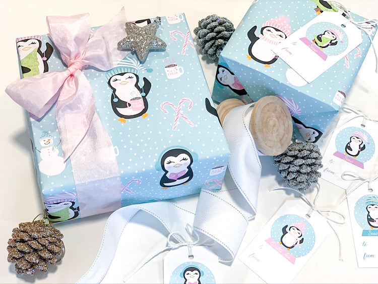 Three sheets of winter themed penguin themed luxury gift wrap