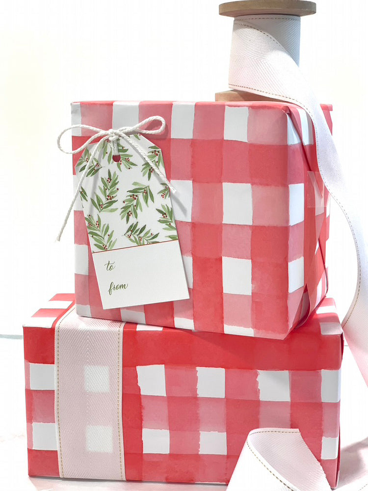 Red gingham gift wrap with a Christmas-themed pattern, also shows coordinating leaf and berry gift tags.