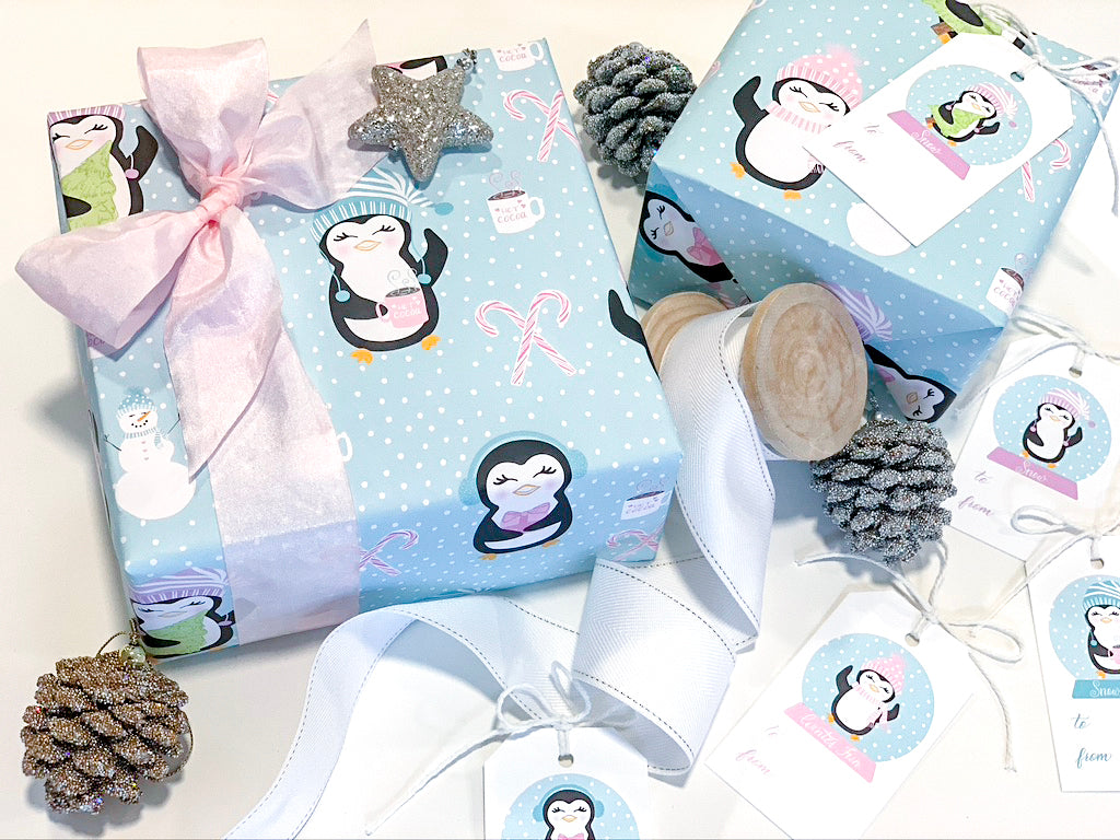 Three sheets of winter themed penguin themed luxury gift wrap 